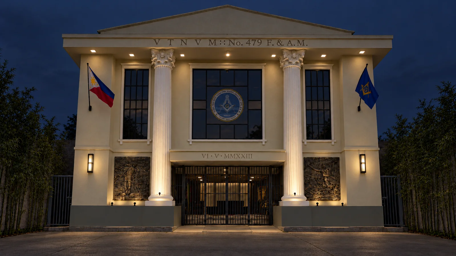 The complete lodge temple at night, its columns warmly lit and official seal above the entrance.